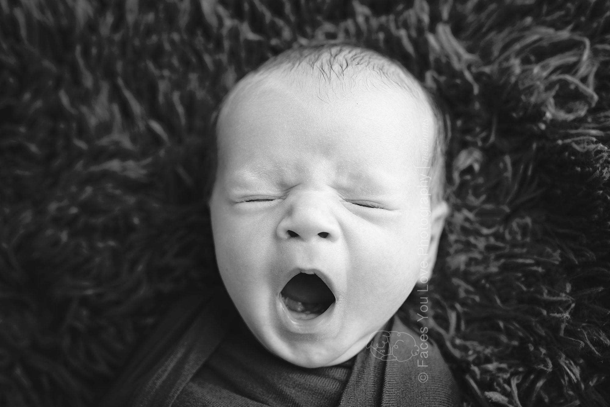 newborn yawn in black and white
