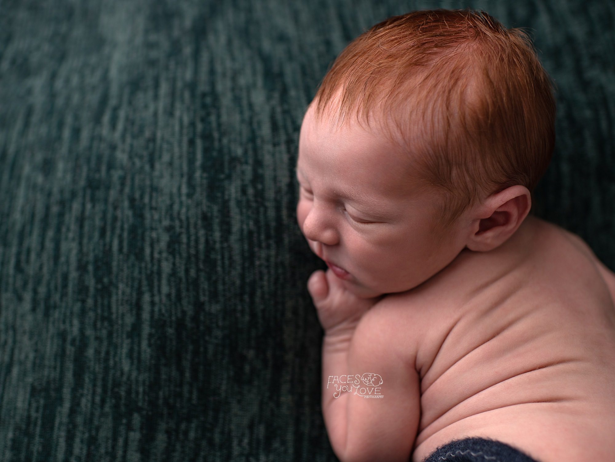 best newborn photographers Kansas City, redhead baby, ginger baby, newborn boy on green